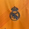 maglia real madrid arancione 2024 stemma