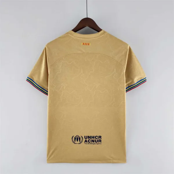 Maglia FC Barcelona Oro 2022-2023 con numero