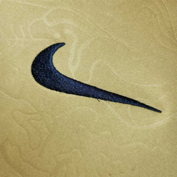 Maglia FC Barcelona Oro 2022-2023 logo