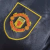 Maglia retro Manchester United nera 1993-1995 stemma