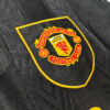 Maglia retro nera Manchester United a maniche lunghe 1993-1994 stemma